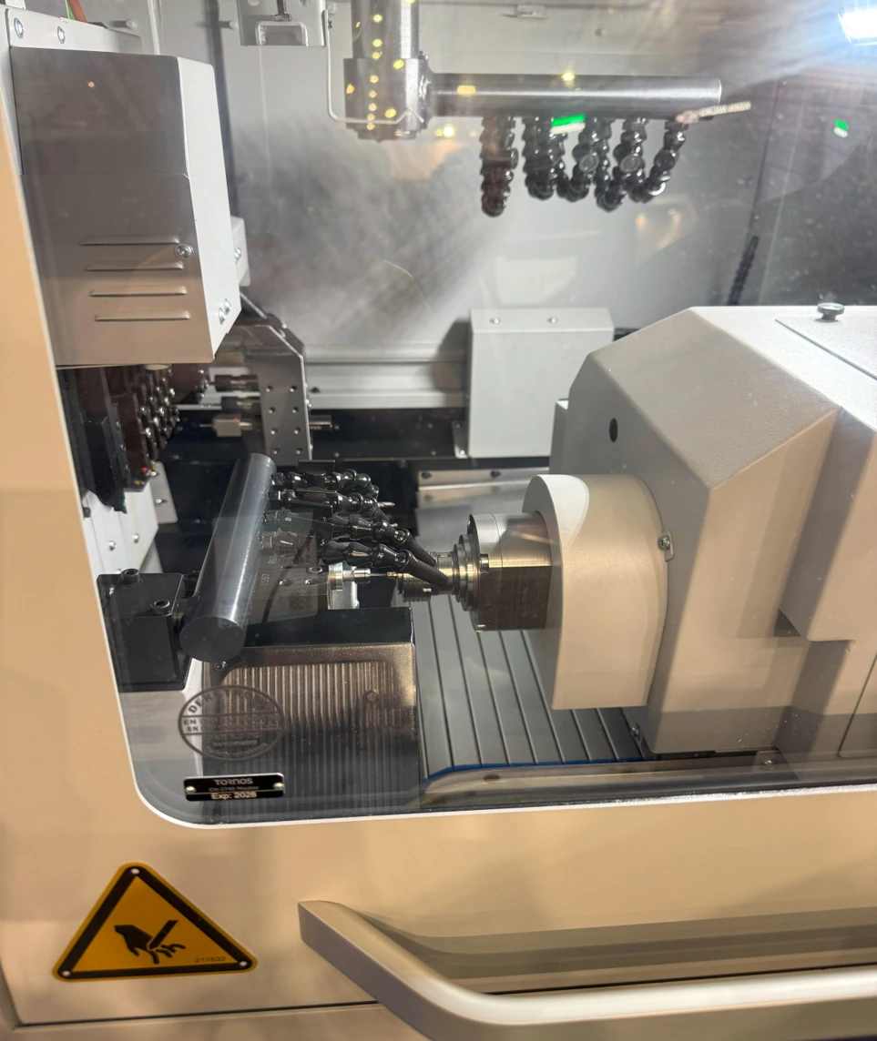 Sub-spindle and tooling inside a Swiss-type machine